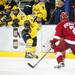 Michigan freshman left wingman Daniel Milne gets rid of the puck in the third period on Saturday. Daniel Brenner I AnnArbor.com